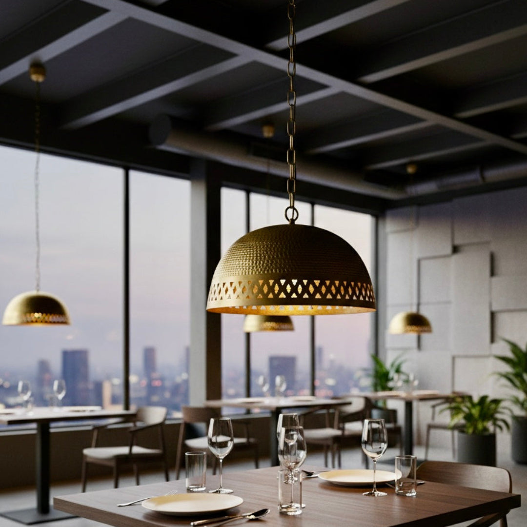 Suspended Moroccan brass dome lights with chain mounts in a high-end restaurant with industrial ceilings and city skyline views.