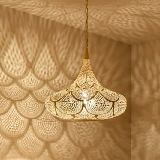  Stunning Moroccan brass pendant lamp and matching wall sconces in a modern green velvet living room.