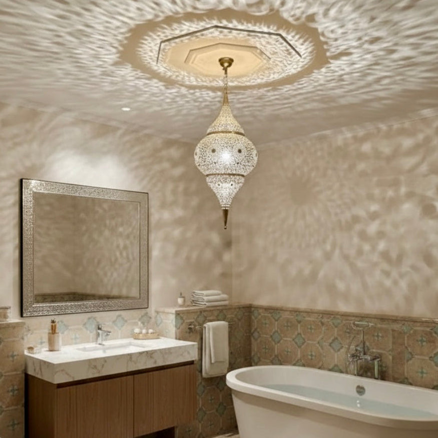 Traditional Moroccan brass ceiling lamp in a luxury bedroom with gold damask wallpaper and elegant curtains.