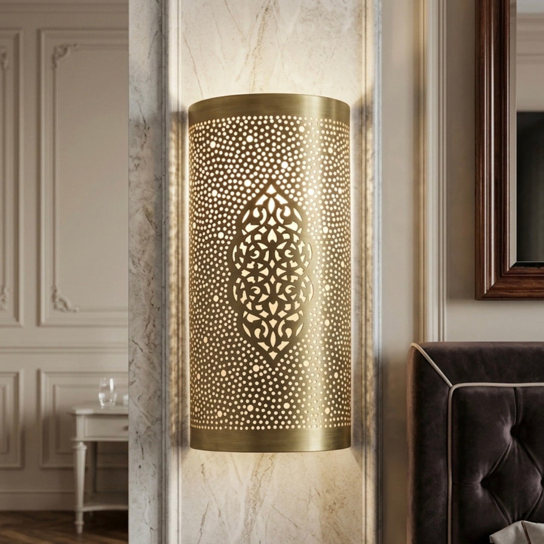 Elegant bedroom decor with a luxury brass wall light mounted on a marble-textured pillar.