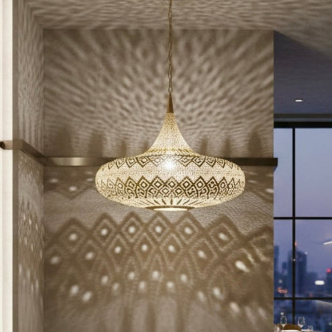 Commercial interior lighting featuring a brass Moroccan lamp in a high-end restaurant with a city skyline view.