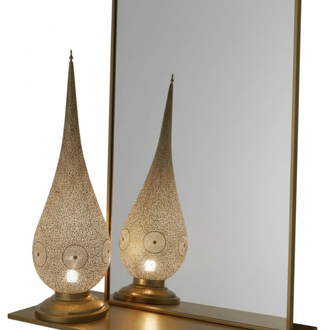 Elegant Moroccan brass lamp on a wooden side table in a minimalist modern living room with a grey sectional sofa and city view.