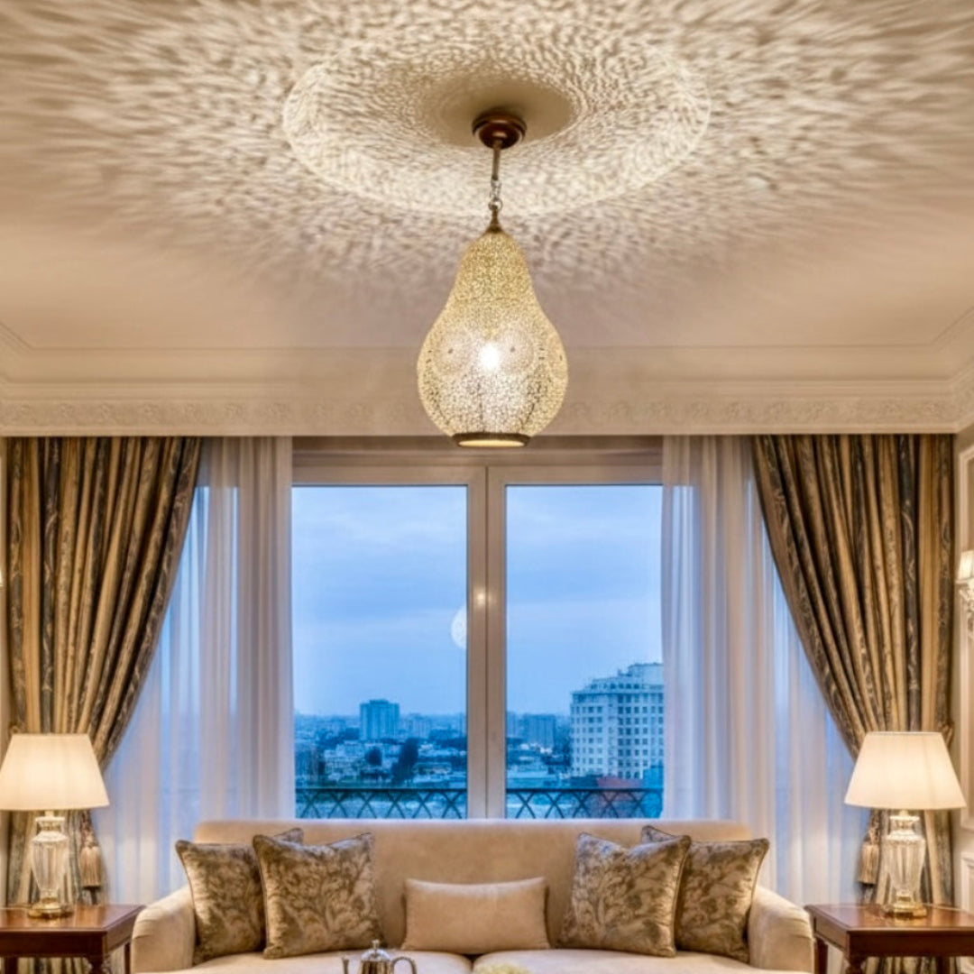 A modern minimalist room styled with a traditional Moroccan metal lamp to add warmth and artisan texture.