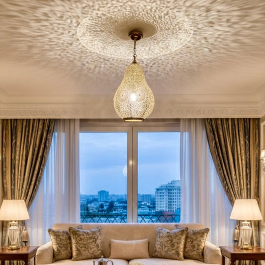 A modern minimalist room styled with a traditional Moroccan metal lamp to add warmth and artisan texture.
