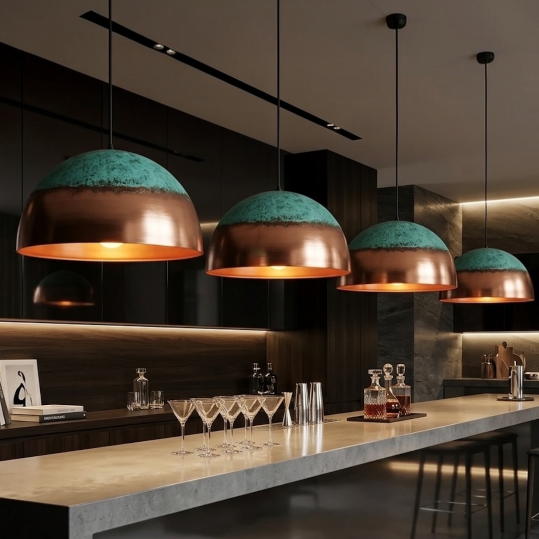  Four handmade Moroccan modern brass dome pendant lights with turquoise patina finish hanging over a luxury kitchen island bar counter
