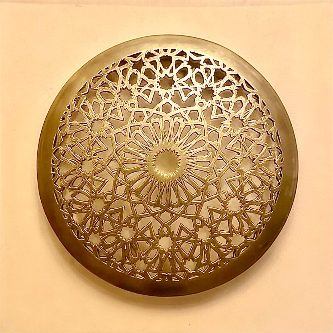 Front view of an unlit modern Moroccan flush mount light fixture made of polished brass with detailed arabesque openwork design.⁠