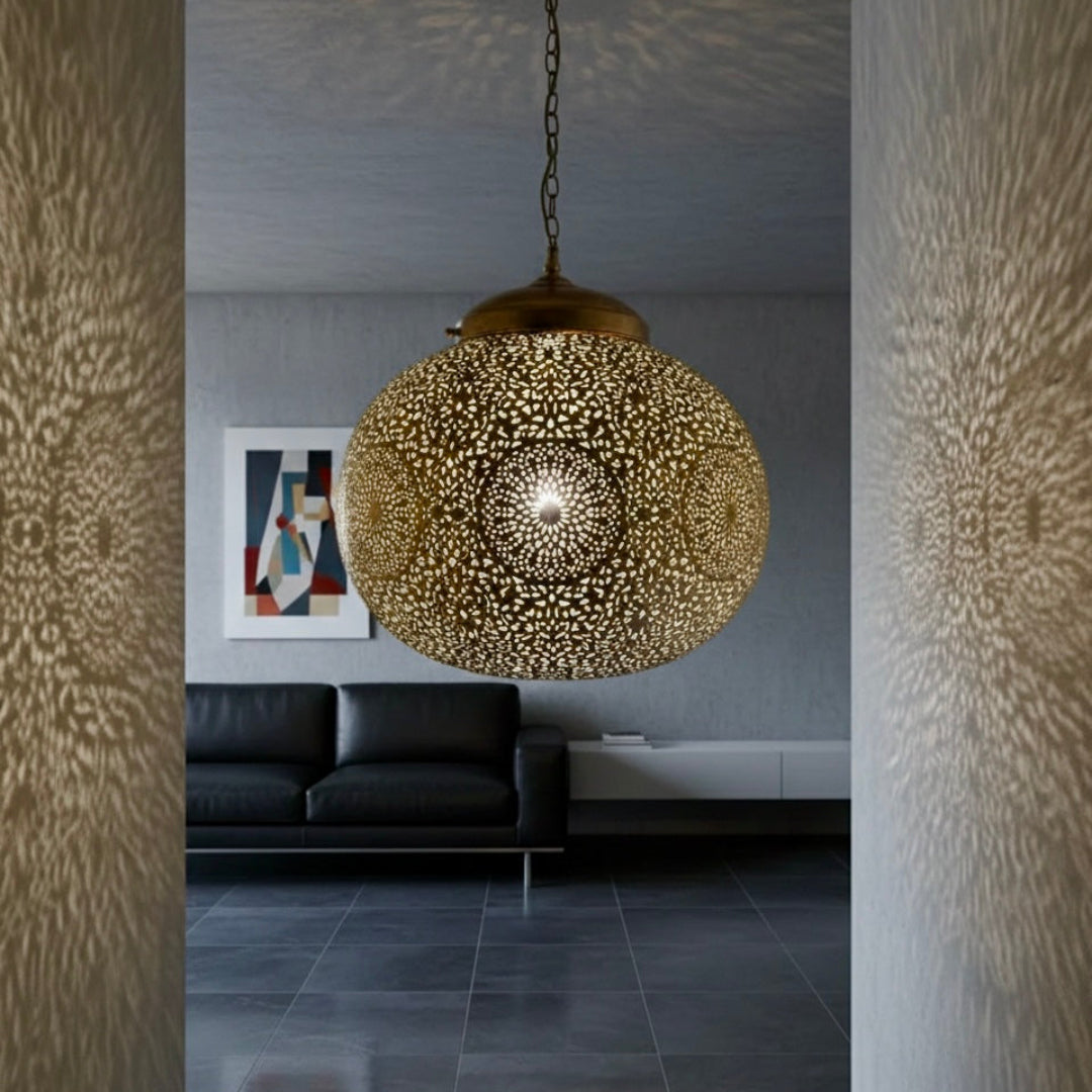 Moroccan brass pendant lamp in a high-end penthouse living room with city view and ceiling shadows.