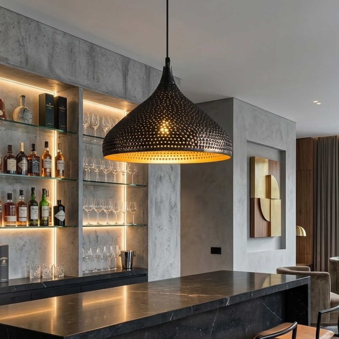  Large handcrafted Moroccan modern brass pendant light casting warm ambient light above a stylish home bar counte