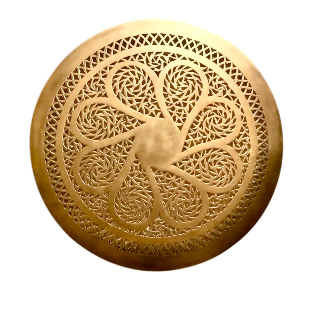 Handmade Moroccan flush mount ceiling light in unlacquered brass, featuring an intricate geometric cut-out floral pattern, isolated on a white background.