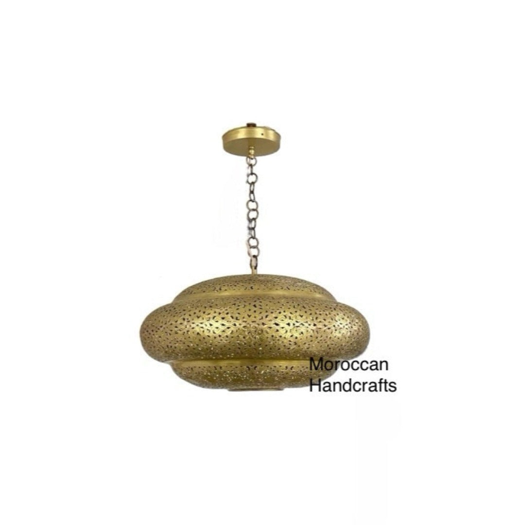 Intricate geometric light patterns projected on walls by a Moroccan brass pendant light.