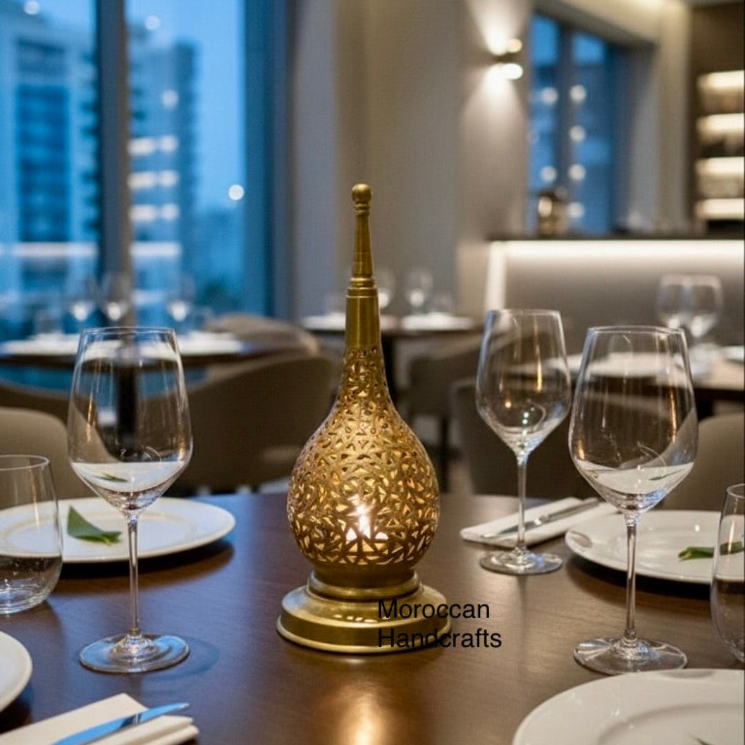  Close-up of artisan craftsmanship on a Moroccan brass lantern showing geometric cutouts.