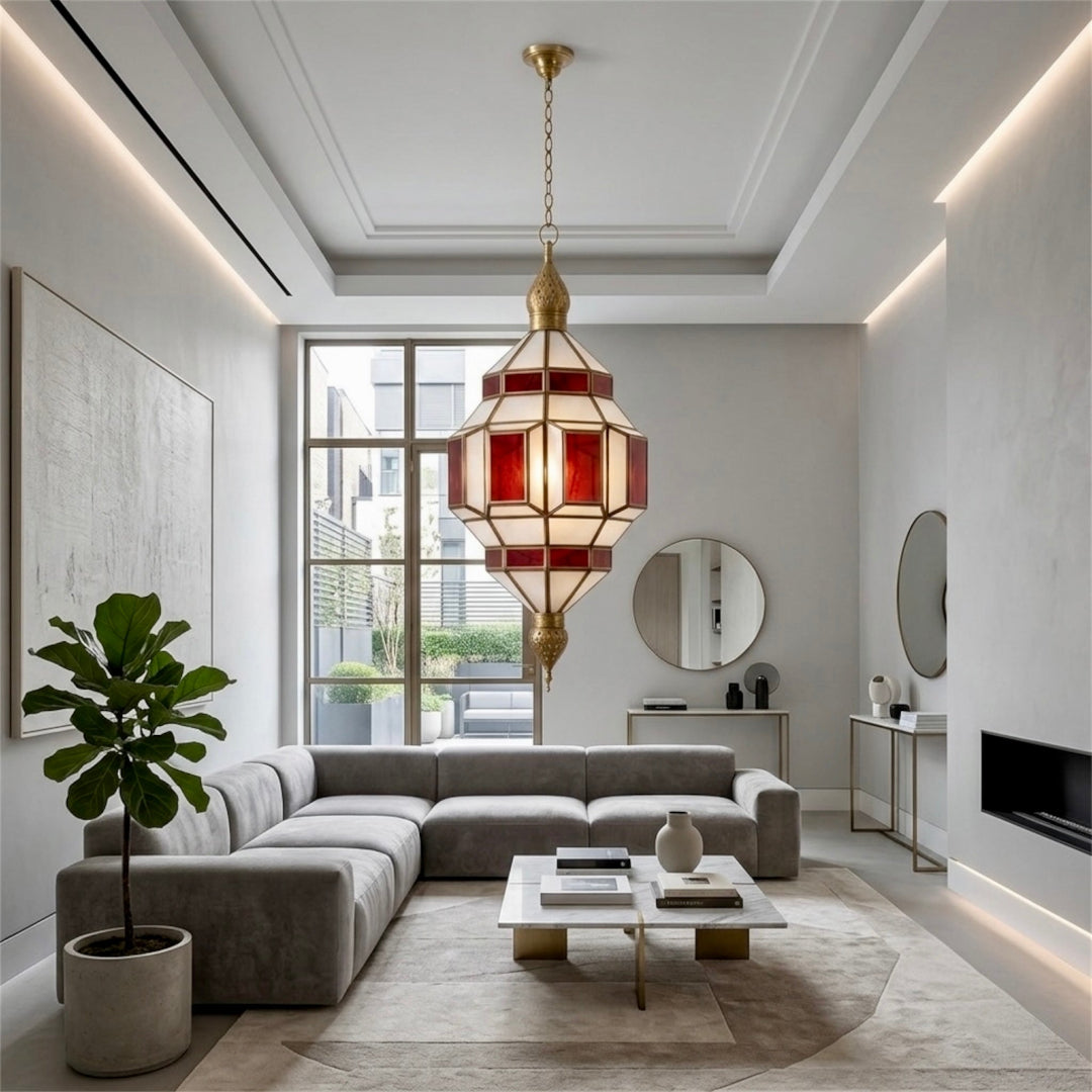 ⁠Modern Moroccan brass hanging light fixture centered over a sectional sofa in a neutral living room⁠