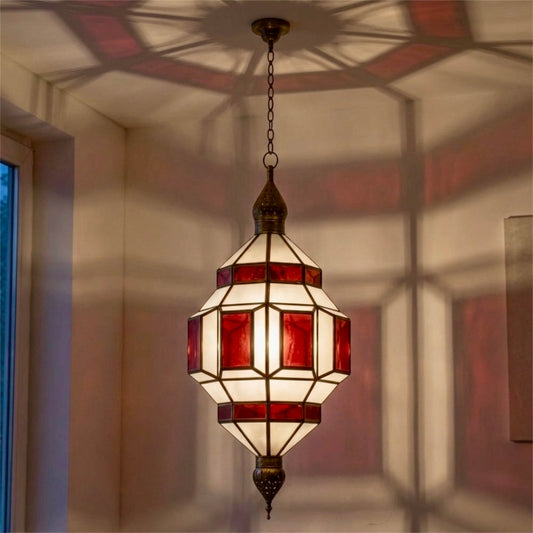  ⁠Artisanal Moroccan brass pendant light with red stained glass panels isolated against a clean white backdrop⁠
