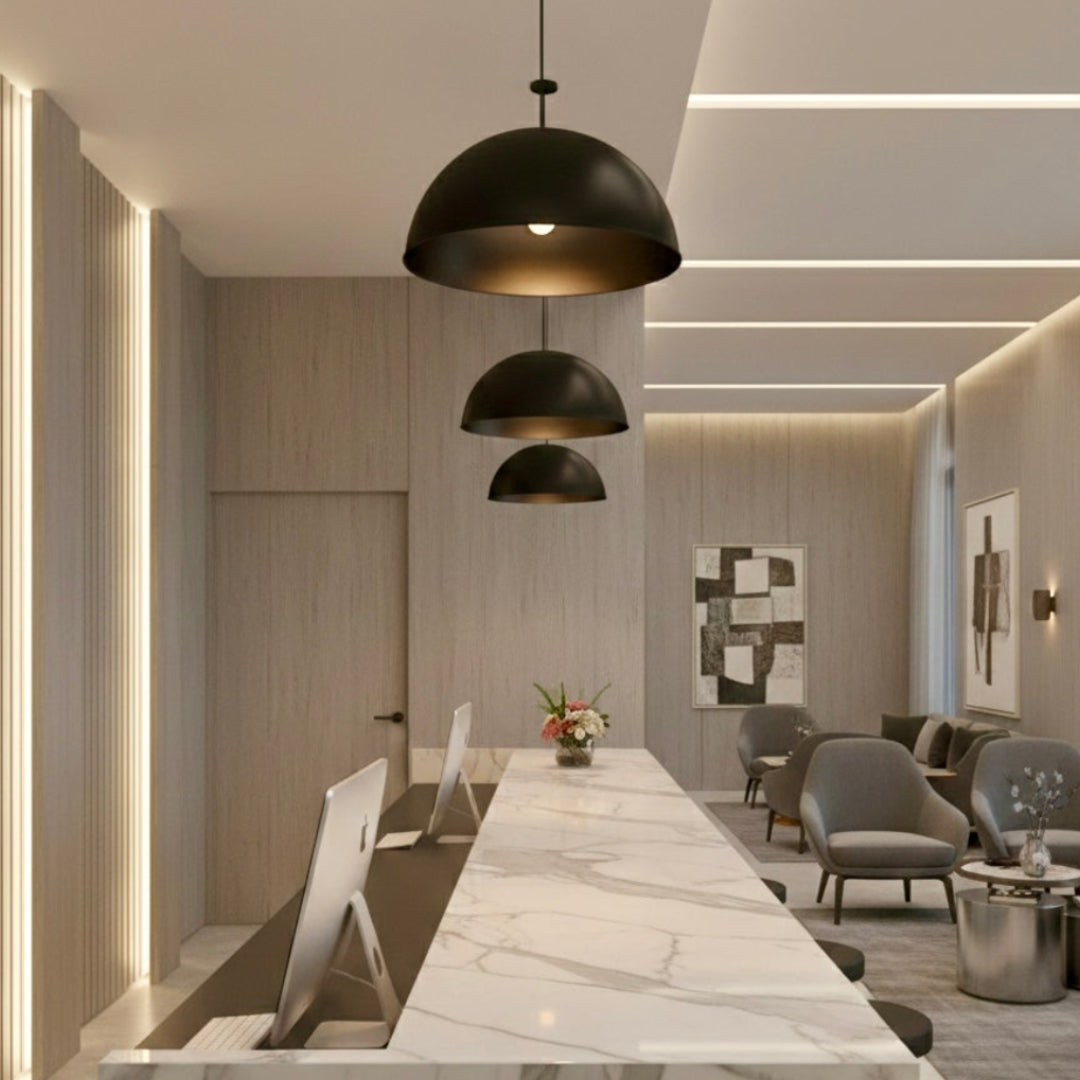 Close-up of a handcrafted Moroccan dome pendant lamp in matte black brass finish with a clean minimalist silhouette.