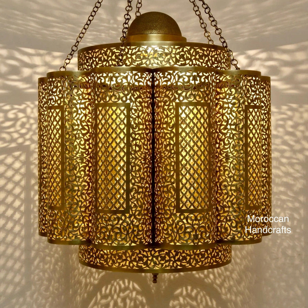  Multilayered brass lantern light fixture, typical of Arabic and Moorish metalwork, hanging from the ceiling.
