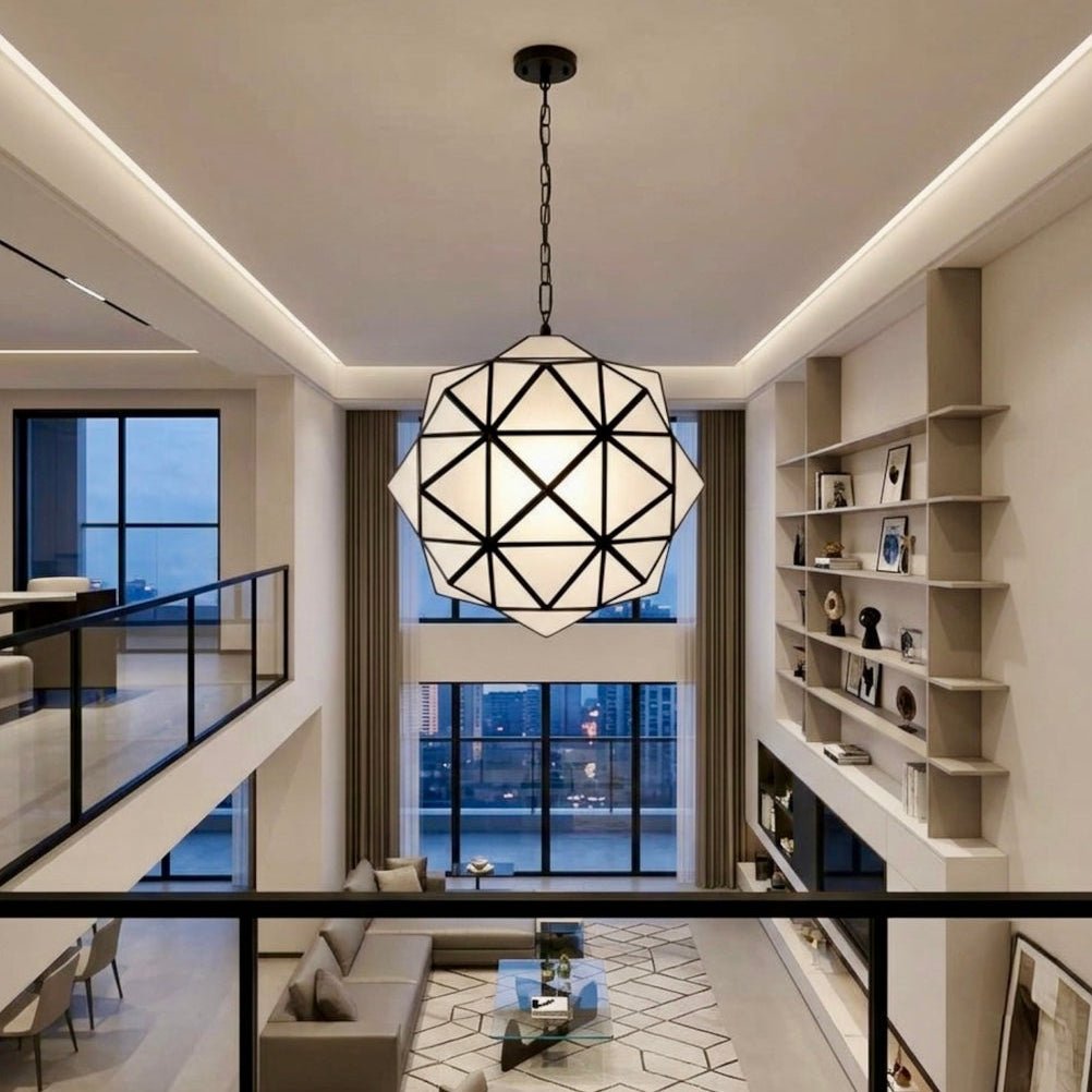 ⁠Large geometric frosted glass and dark brass hanging light fixture in a modern double-height ceiling apartment