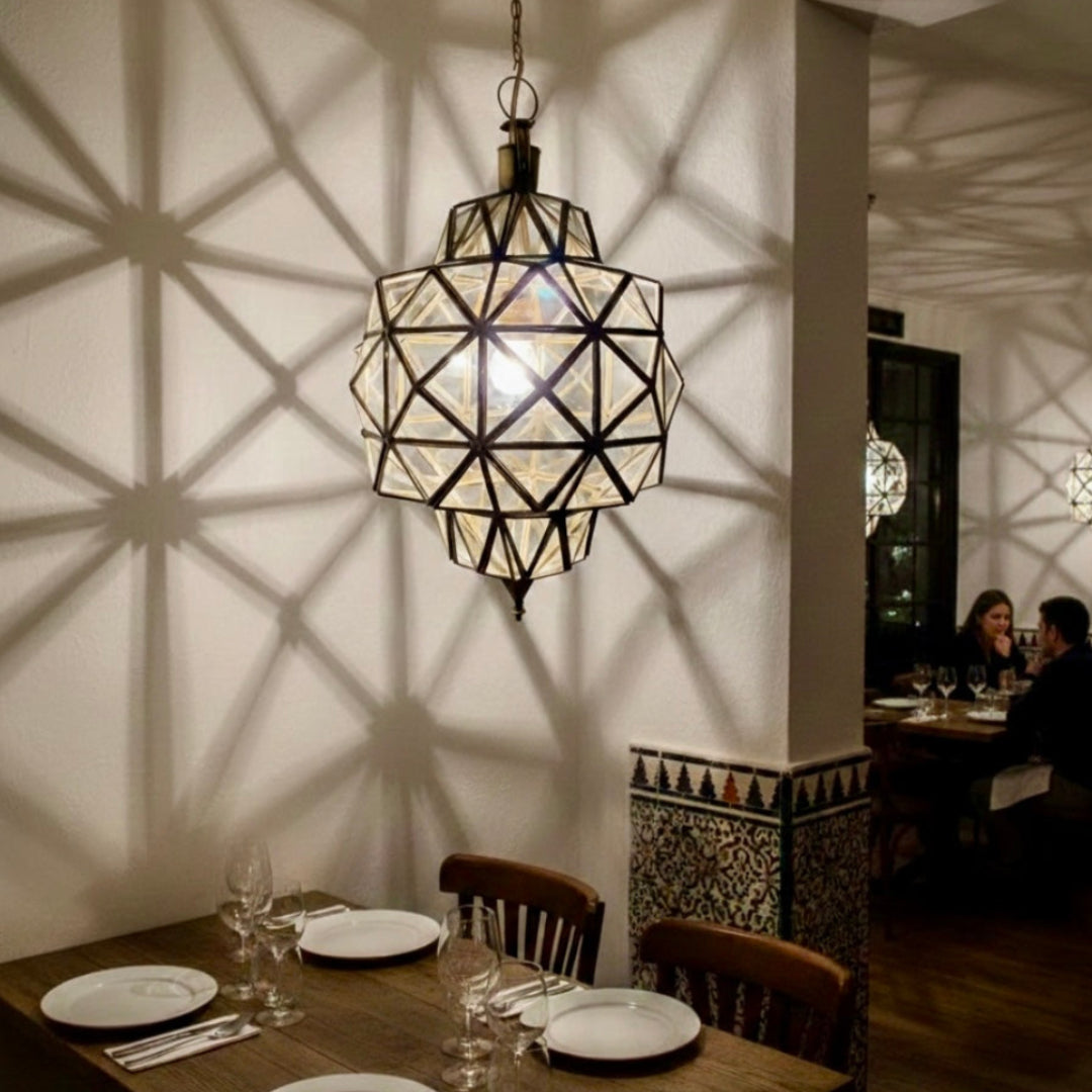 Authentic Moroccan handcrafts lamp installed in a restaurant setting for a warm and cozy ambiance.