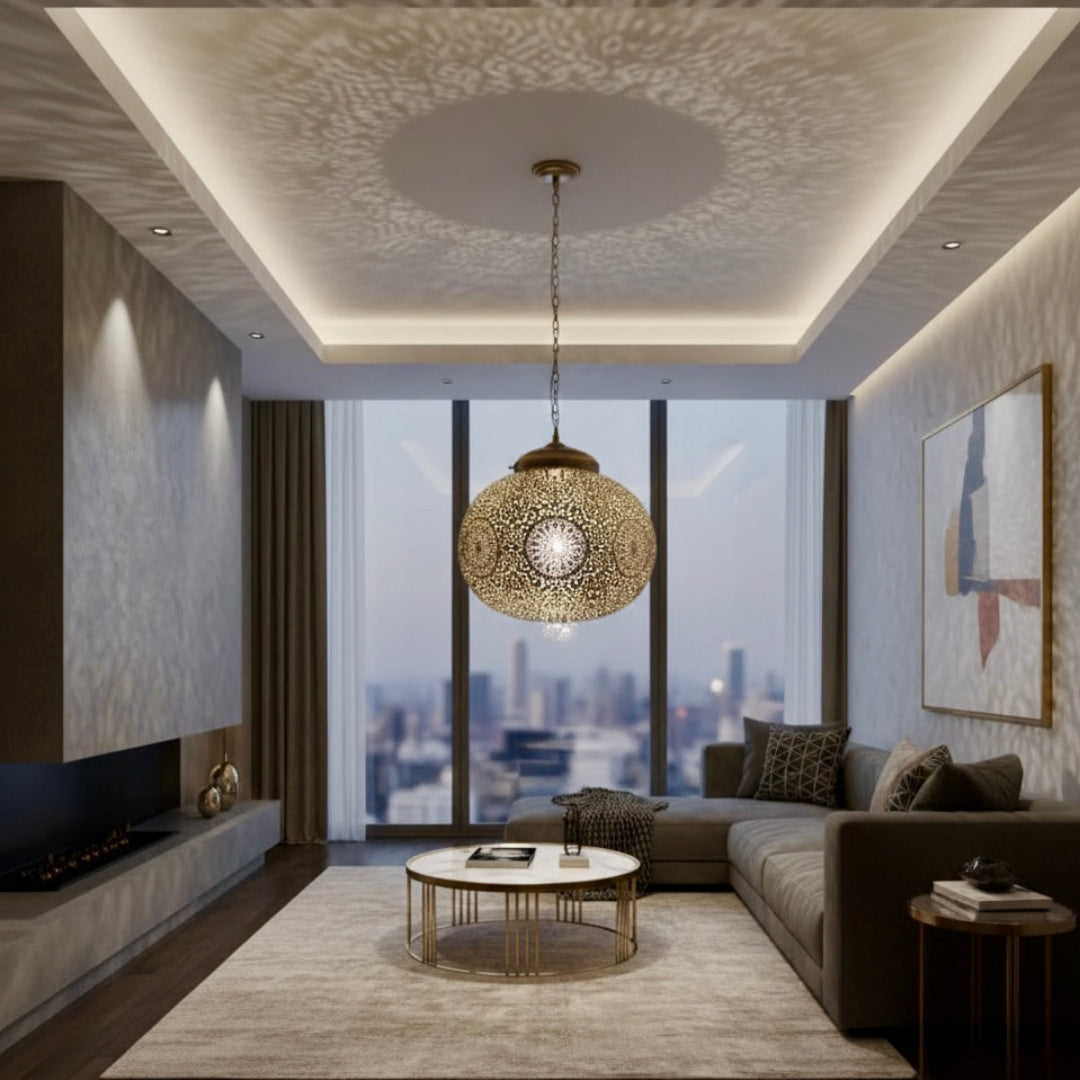 Large handmade Moroccan brass pendant light casting intricate shadows in a modern living room.
