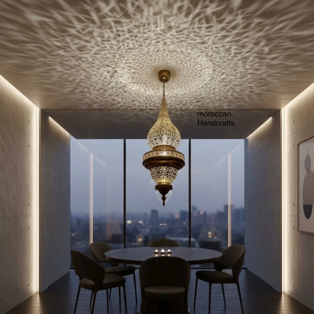 Ornate brass Moroccan hanging lantern ('Fanoos') with detailed filigree etching, perfect for bohemian interior decor.