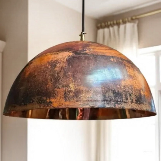  Antique modern Moroccan brass dome pendant light centered above a light oak dining table
