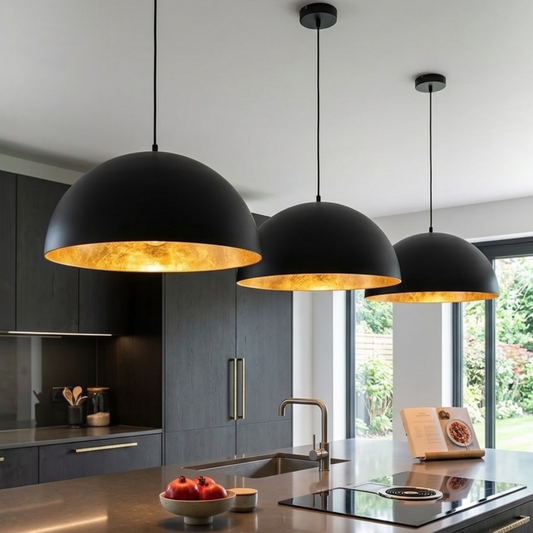 Set of three handmade Moroccan brass dome pendant lights hanging above a modern dark wood kitchen