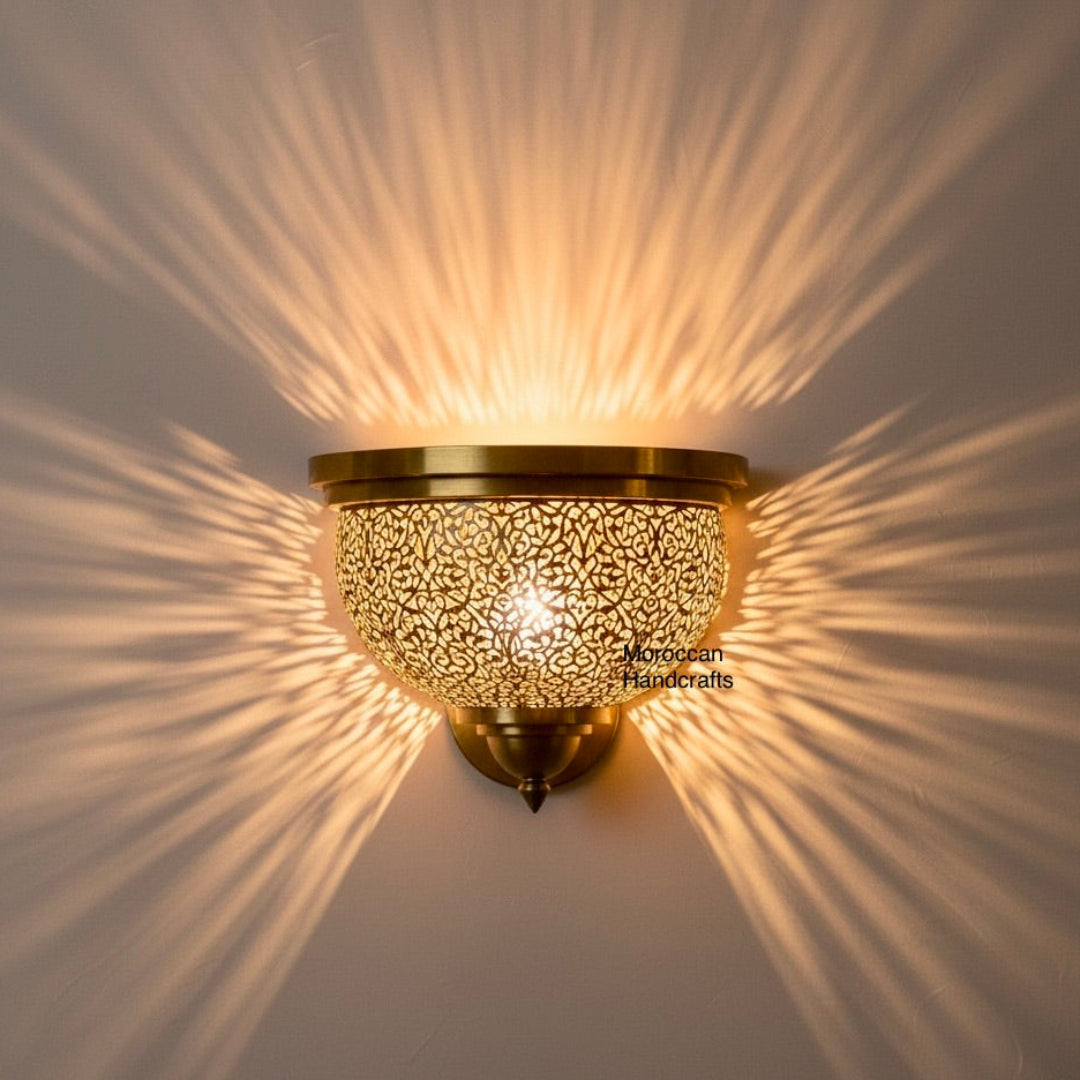 Vintage brass wall lamp casting sunburst light rays in a modern room.