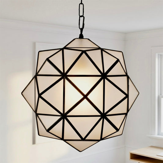  ⁠⁠Handmade modern Moroccan geometric brass pendant light with frosted glass panels hanging in a contemporary open-concept living room.⁠